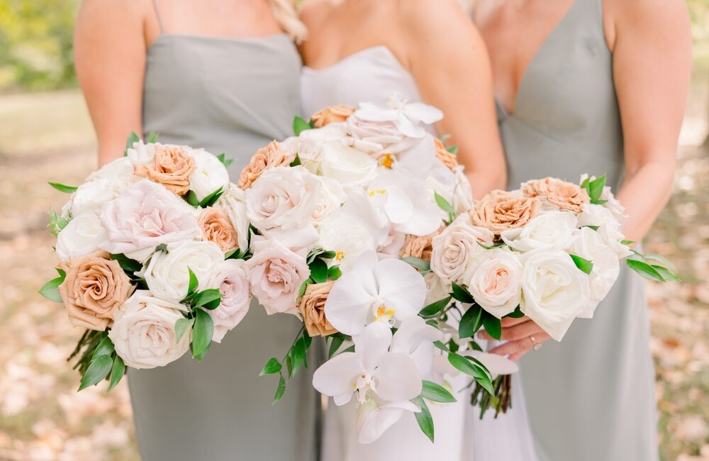Bride,And,Bridesmaids,Holding,Bouquets